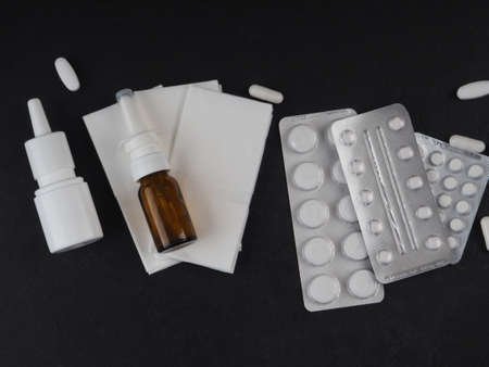 Pills in plastic package. Concept of healthcare and medicine. Coronavirus 2019-nCoV, thermometer, runny nose, treatment of the disease.の写真素材