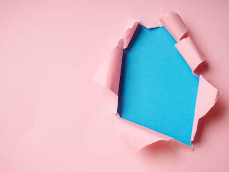 background with torn paper and place for your message, trending holes in paperの写真素材