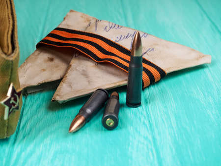 9 May, Victory Day holiday. George ribbon, letters, cartridges, cap. traditional symbol of Victory Day 1945. Russiaの写真素材