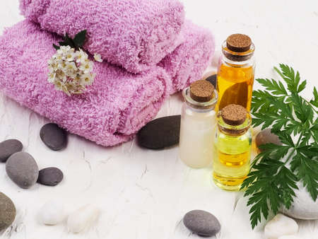 Spa accessories with stones, Composition of spa treatment on table colorful backgroundの写真素材