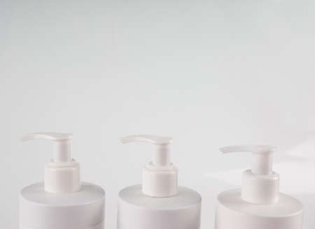 multiple bottle dispensers close-up, sanitizer, hand treatment, hygiene, hand wash.の写真素材