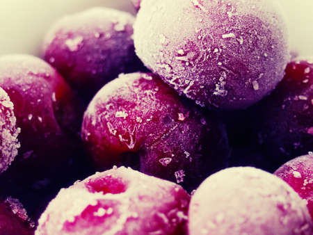 Red berries frozen cherry winter food background.の写真素材