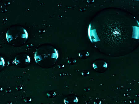 drops of blue dark background as a backing. Large drops close up abstract for backgroundの写真素材