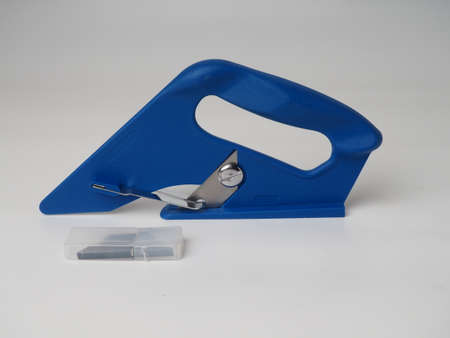 blue carpet cutter, tool isolated on white background.の写真素材