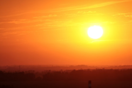 with the sunshine and clouds above the horizon. Divine glow through the clouds of the evening warm sun. Concept of peace and happinessの写真素材