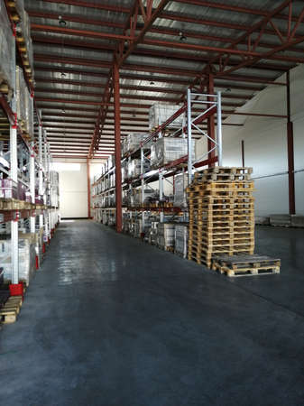 Shelving System With Boxes in Distribution Warehouse, Large industrial warehouse with high racks.の写真素材