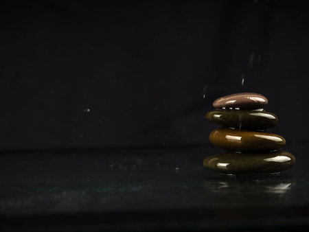 Pyramid of spa stones on dark background, Zen stones