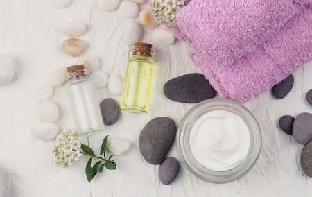 Spa accessories with stones, Composition of spa treatment on table colorful background.の写真素材
