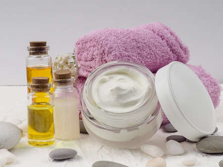 Spa accessories with stones, Composition of spa treatment on table colorful background.の写真素材