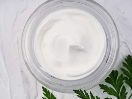 face and body cream on a white background, self-care, health and beauty.の写真素材