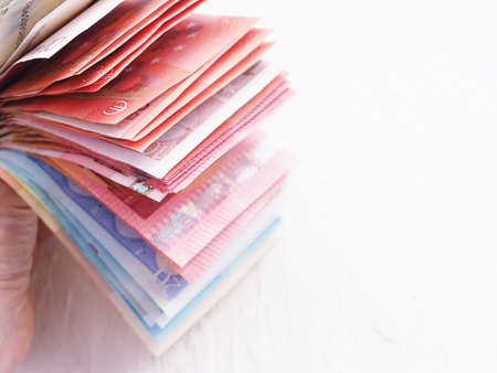 stack of Euro money on a white background, coins cents. The concept of Finance and business.の写真素材