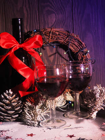 Mulled wine with spices, orange and lemon on a black table. Christmas conceptの写真素材
