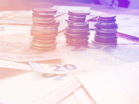 background of Euro and dollar banknotes and coins, the concept of Finance and poverty.の写真素材