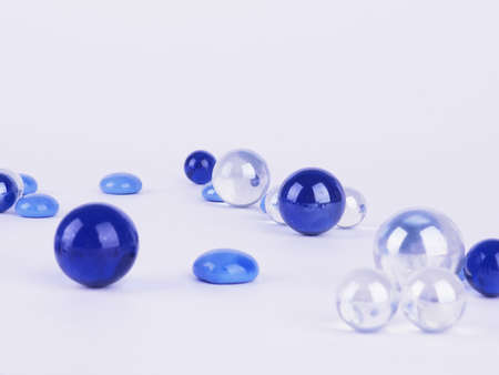 blue balls on white background, abstract background scattered glass balls.の写真素材