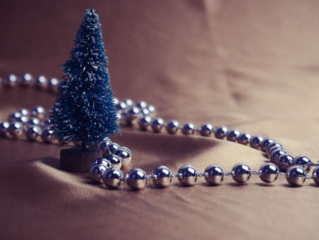 Christmas symbols, balloons and Christmas trees on a Golden background. the concept of a new year.の写真素材