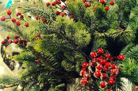 christmas and new year concept .Red balls on fir branches, winter snowy backdrop. festive winter holiday background. template for design. banner, copy space.の写真素材