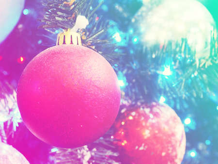 christmas and new year concept .Red balls on fir branches, winter snowy backdrop. festive winter holiday background. template for design. banner, copy space.の写真素材
