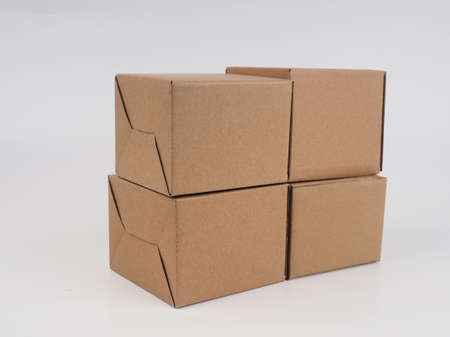 several cardboard boxes. Cardboard Boxes Stacked Against White Background.の写真素材