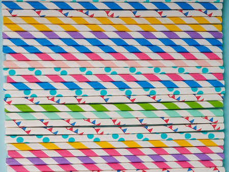 Group Of Cardboard Tubes For Cocktails. Top view of colorful paper disposable eco-friendly straws for summer cocktails. Drinking paper colorful straws for summer cocktailsの写真素材