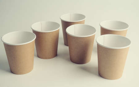 a few empty paper cups. Zero waste concept, paper tableware. Paper cup. Recycling. Eco-friendly disposable tableware. Eco dishesの写真素材