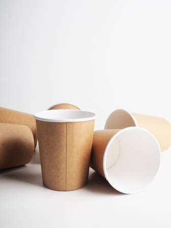 a few empty paper cups. Zero waste concept, paper tableware. Paper cup. Recycling. Eco-friendly disposable tableware. Eco dishesの写真素材