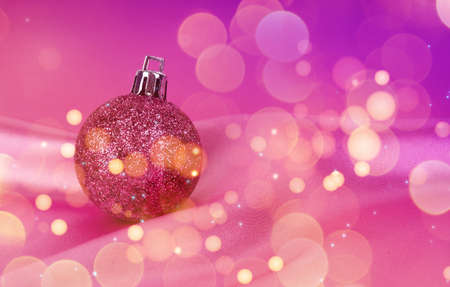 Christmas concept, new year symbol on pink background, Christmas card design, with balls, Christmas tree.の写真素材