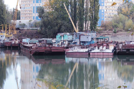 Old rusty barge and tug. a few rusty barges.の写真素材