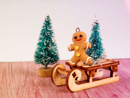 Gingerbread man and a small Christmas tree. traditional Christmas dessert cookies.の写真素材