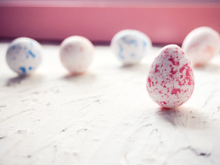 Close-Up Of Multi Colored Easter Eggs Against Wallの写真素材