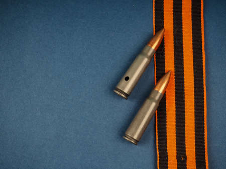 Victory Day Still Life, St. Georges ribbon on a blue background, postcard, place for text, victory day may 9の写真素材
