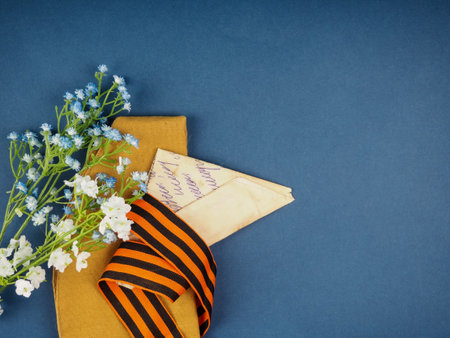 Victory Day Still Life, background for postcards by may 9, victory day: cap, letters, and St. George ribbonの写真素材