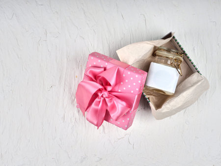 One jar of cream, lotion empty label in a box with a pink ribbon