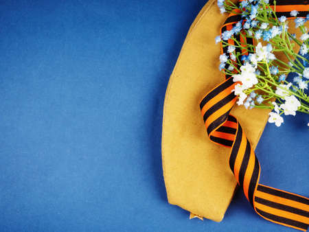 Victory Day Still Life, background for postcards by may 9, victory day: cap, letters, and St. George ribbon.の写真素材