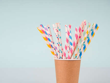 Several colorful cocktail tubes in a glass.の写真素材