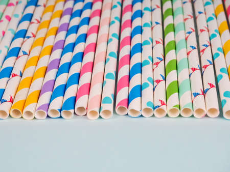 Many colored tubes in a row on a blue background.の写真素材