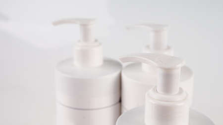 several bottles with a dispenser close-upの写真素材