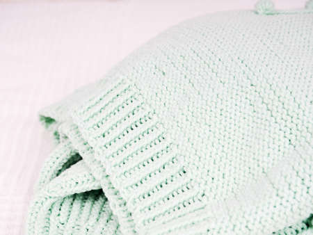 Abstract knitted background. Wool sweater with sleeves. Close up picture of knitted pattern.の写真素材