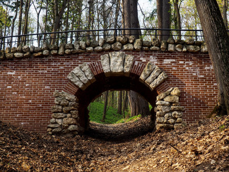 Part of the old bridge with an arch, brickwork.