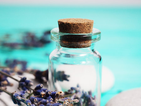Close-up of a bottle with lavender seeds.