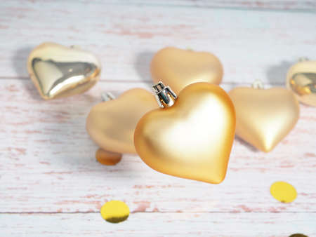Christmas bauble. Christmas toy in the shape of a heart of gold color. Christmas. New year stock photo.の写真素材