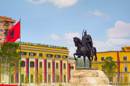Tirana, Albania. November 26, 2017: Newly reconstructed city central Skanderbeg square, decorated with red and black and raised National Flag for Independence Day celebrationのeditorial素材