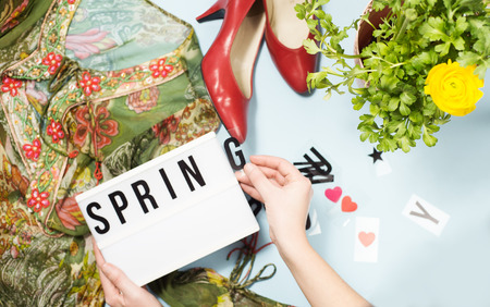 Spring summer fashion look with floral prints, red shoes, ranunculus flower, text frame Spring summer fashion look with floral prints, red shoes, ranunculus flower, text frame の写真素材
