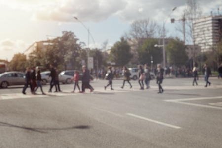 Blurred image of people moving in crowded city street.の写真素材