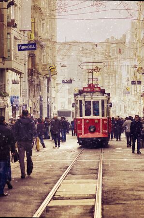 Taksim square in Istanbul and red tram in winter.のeditorial素材