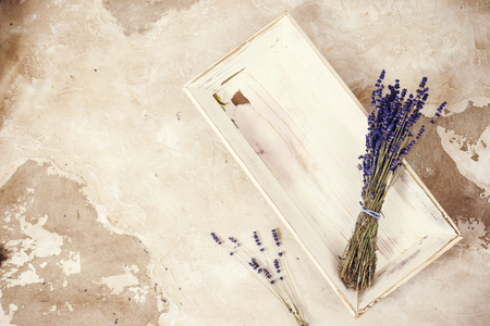 Lavender flowers bouquet overhead on textured background, vintage toningの写真素材