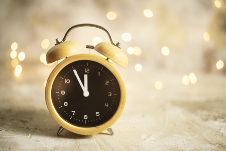 vintage alarm clock showing midnight. christmas and bokeh,の写真素材