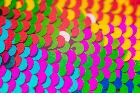 Background sequin. Holiday abstract glitter background with blinking lights. Fabric sequins in...