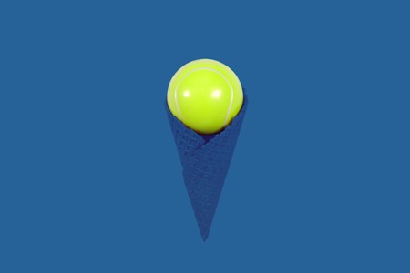 Ice cream cone with tennis ball on bright blue background. Minimal conceptの写真素材
