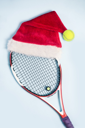 santa hat on tennis racket on white backgroundの写真素材