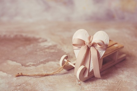 Heart on a wooden sled. St. Valentines Day backgroundの写真素材